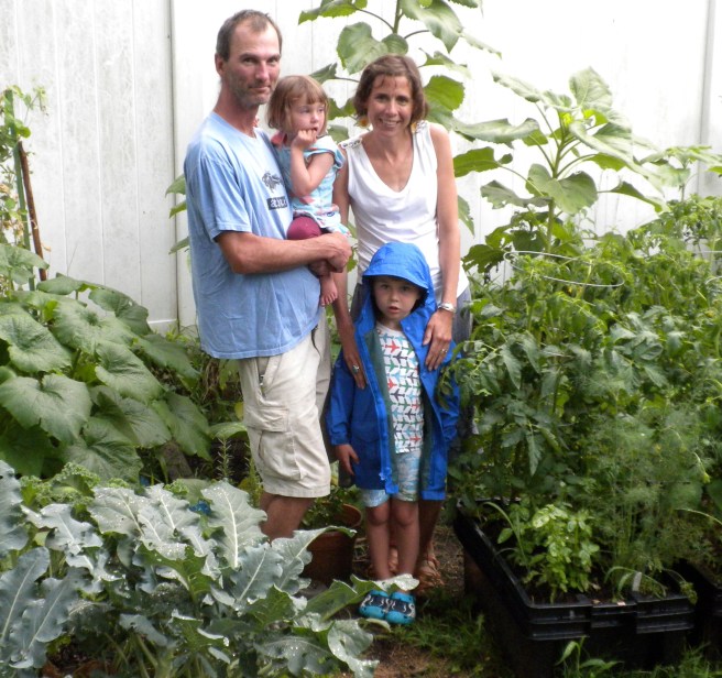 Peggy and her family in their garden.JPG